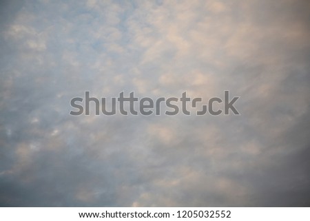The sun's rays illuminate the sky with clouds. We see the background of the sky of natural color as in the picture. This image of a beautiful sky and white clouds pleases all people.