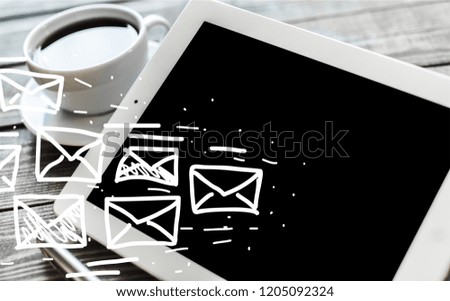 Tablet computer and cup of coffee