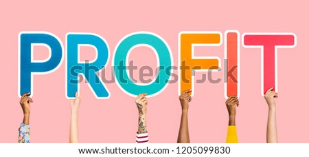 Hands holding up colorful letters forming the word profit