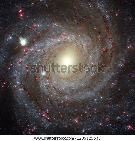 This image of the spiral galaxy NGC 3344, located about 20 million light-years from Earth. Elements of this image furnished by NASA