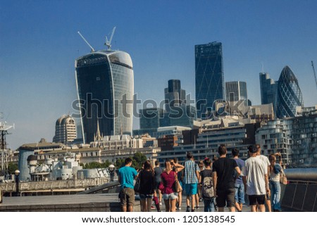 business city in London on a sunny day in the summer tourists in the foreground