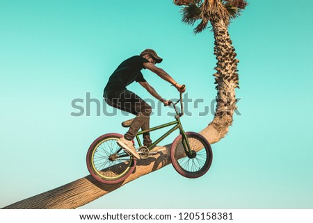 Young man with a bmx bike around the city. BMX freestyle
