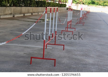 Traffic Barrier made of red and white iron on car park . For do not park