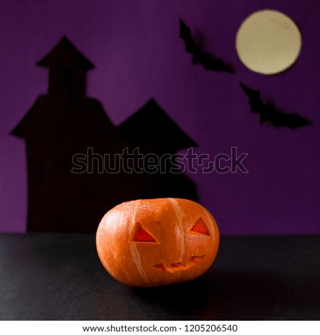 Pumpkin with glowing eyes on a dark background. Scary halloween pumpkin.