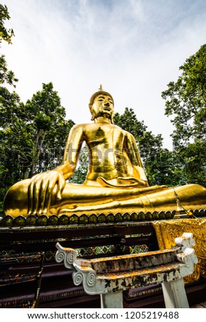 Beautiful golden Buddha statue in Analyo Thipayaram temple, Thailand.