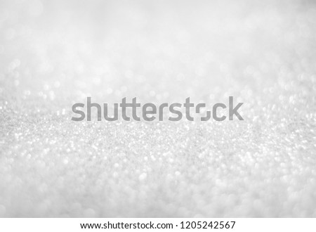 Abstract of Bright and sparkling bokeh background. silver and diamond dust bokeh blurred lighting from glitter texture. Royalty-Free Stock Photo #1205242567