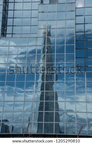 glass buildings showing reflections
