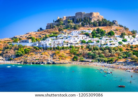 Rhodes, Greece. Lindos small whitewashed village and the Acropolis, scenery of Rhodos Island at Aegean Sea. Royalty-Free Stock Photo #1205309086