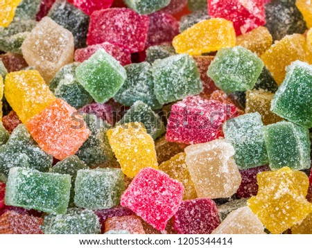 Pile of various Turkish delights. Multi-colored  square lokum. Pile of colorful Turkish delight powdered sugar Royalty-Free Stock Photo #1205344414