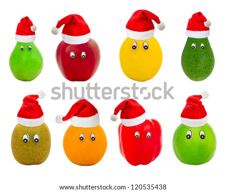 Set of fruit with eyes in red hats of Santa Claus isolated on a white background