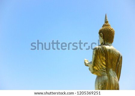 Standing buddha statue on blue sky ,nan thailand