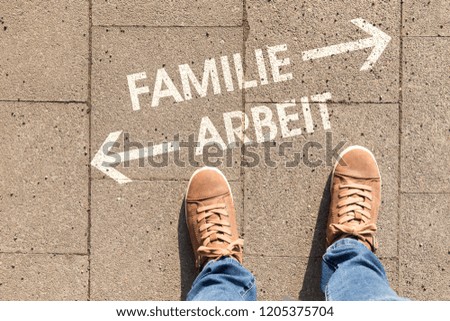 decision with german text Familie Arbeit, in english family work 