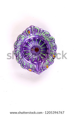 Colorful diwali diyas or clay lamps on white background with space for messages