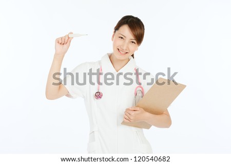 Beautiful young nurse on white background