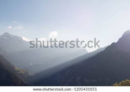 panoramic view of the mountains with blue layers and fog