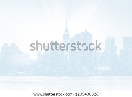 Light blue image of Manhattan skyline at sunset. New York City