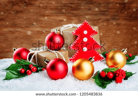 Christmas toy tree with gifts, colored balls on a snow background. Christmas background concept