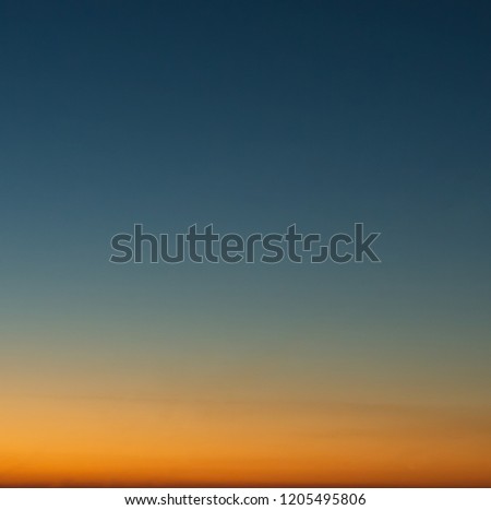 Concept of summer holidays, abstract blur sunset gradient sky background, blue and orange
