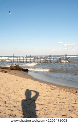 Photographer shadow on sand