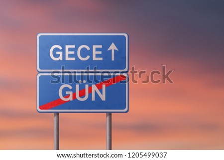 night and day - blue road sign with inscriptions in Turkish