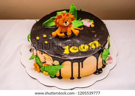 Birthday Cake Decorated With Lion On The Top