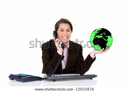 Attractive smiling young secretary, making a global phone call. White background, studio shot. European continent on globe