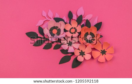 Flower and leaves made of paper on a pink background. Handwork, favorite hobby. Birthday and Valentine's Day