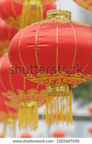 Many hanging red lantern.It usually used to celebrate when some festival is coming like Spring Festival , National Day and so on .