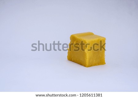 Yellow corn pudding on white background