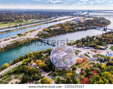 Aerial view of Montreal showing the Biosphere Environment Museum and Saint Lawrence River during Fall season in Quebec, Canada.  Royalty-Free Stock Photo #1205629267