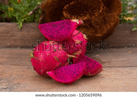purple dragon fruit on table wood with honeycomb background
