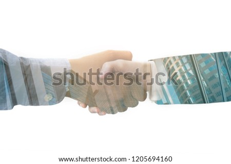 Double exposure handshake on city background for business successful. Royalty-Free Stock Photo #1205694160