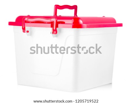 White plastic box with red cover on white