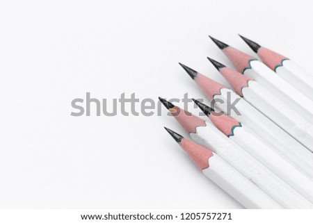 White wooden pencils on white background. Top view and copy space. Business concept