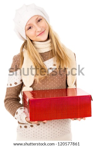 Teen girl in a hat holding a gift isolated