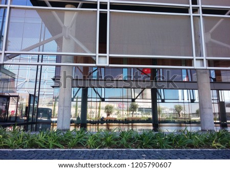 Part of factory building with modern architecture, beautiful steel and glass elements