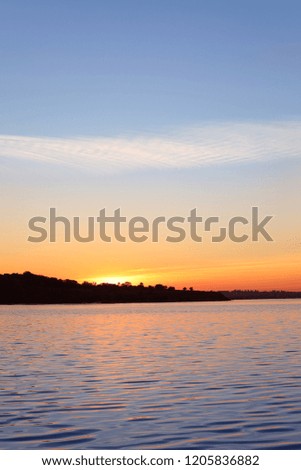 Picturesque view of beautiful sunset on riverside