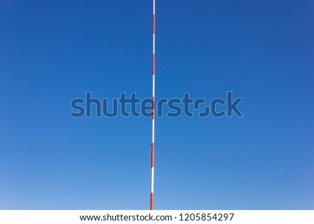 pole of aerodrome wind vane on sunny autumn day in south germany