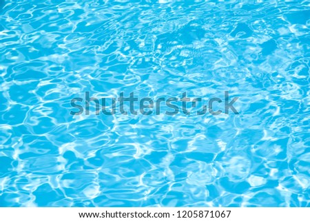 Blue water in swimming pool background