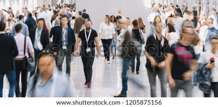 large crowd of anonymous blurred people in new york