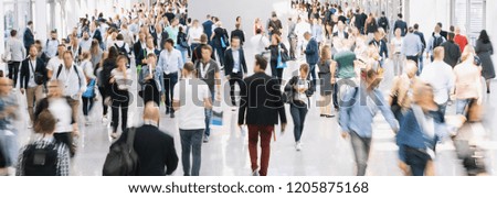 large crowd of anonymous blurred people