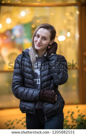 Outdoor fashion photo of young beautiful lady in black jacket