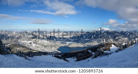 Beautiful lake Wolfgangsee in upper Austria. This picture was taken in winter from mountain Zwolferhorn. That day was nice weather and some clouds