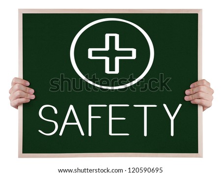 safety sign on blackboard with hands