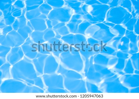 Ripple water in swimming pool sun reflection