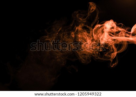 Brown coloured smoke abstract lighting on a black background