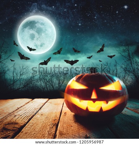 Jack Lanterns Glowing At Moonlight In The Spooky Night - Halloween Scene