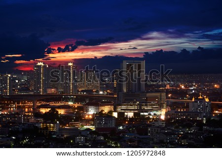 scenic of twilight skyline with cityscape in downtown and bridge for cross the river