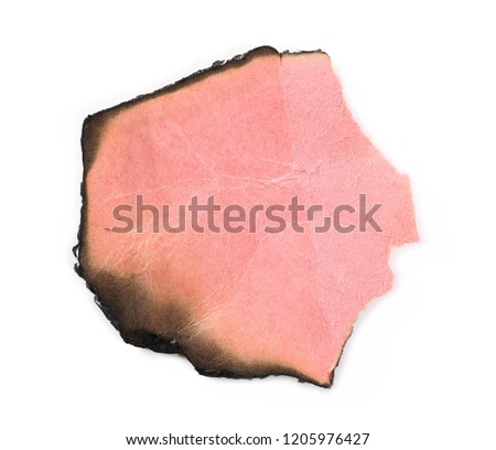 Red charred, burnt cardboard scrap isolated on white background, top view
