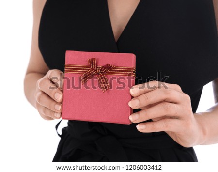 woman holding a gift box in a gesture of giving isolated on white background